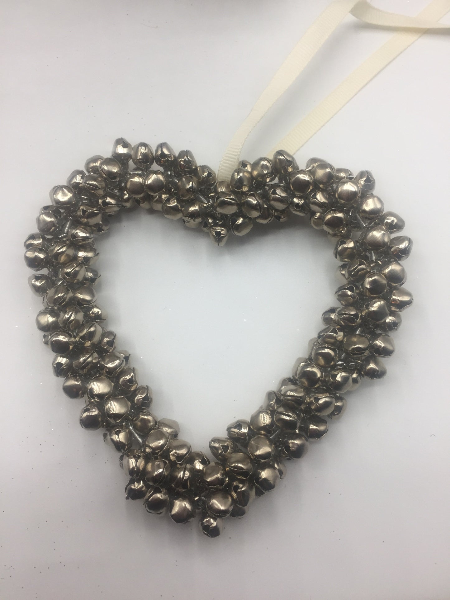 Small hanging silver star wreath with bells