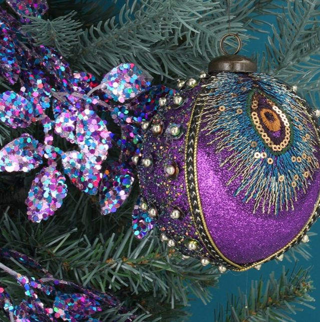 Christmas Decorations in Purple and Gold with Peacock Feather, Lights and  Balls in a Christmas Tree Stock Photo - Image of holiday, season: 184569826