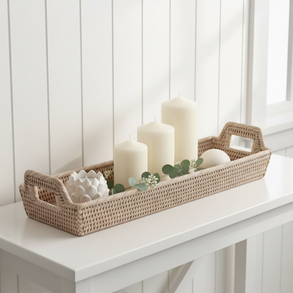 Rattan narrow display tray styled on console table with candles and greenery