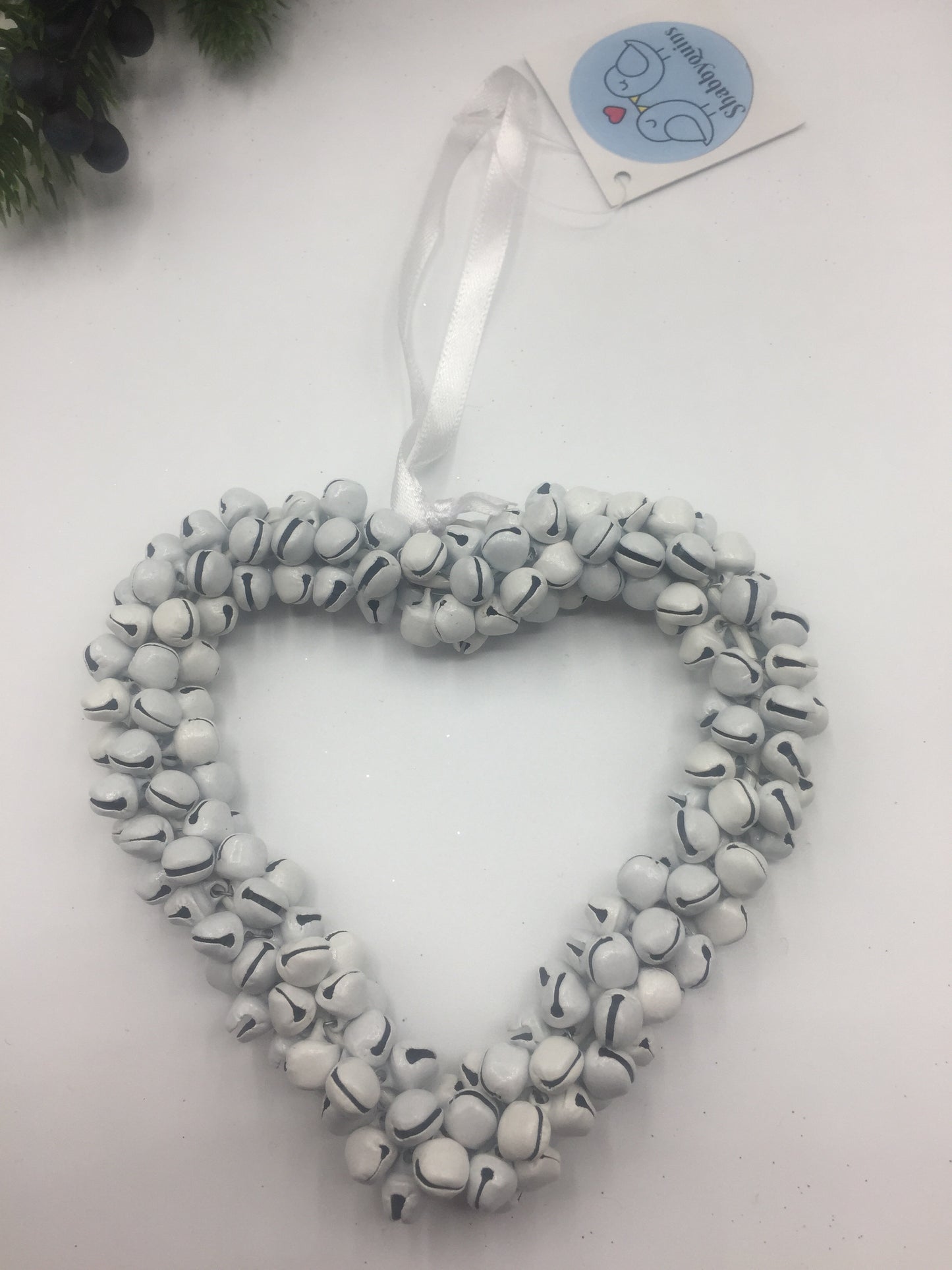 Small hanging silver star wreath with bells