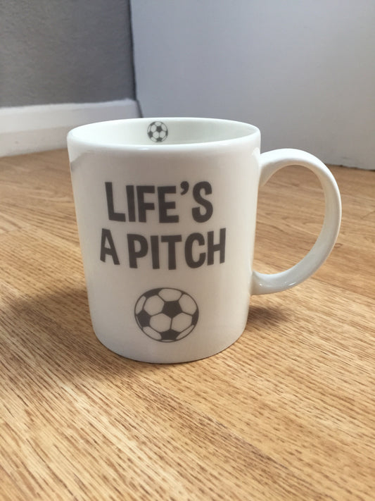 Life’s A Pitch Football Mug